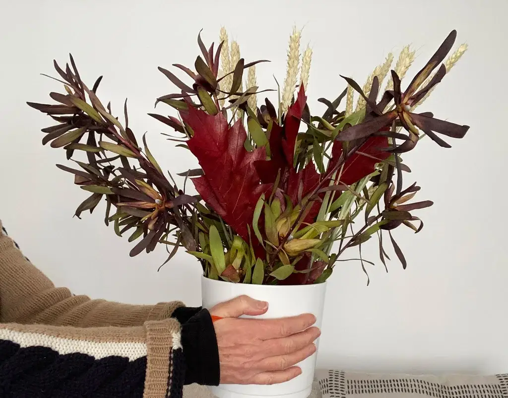 fall flowers and hand