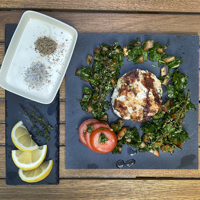 Fish burger, veggies, local salts, tomato, cooking for one in Lisbon
