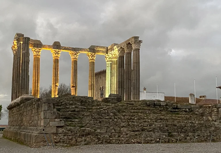 Roman ruins in Elvas at dawn, cloudy skies, lit up