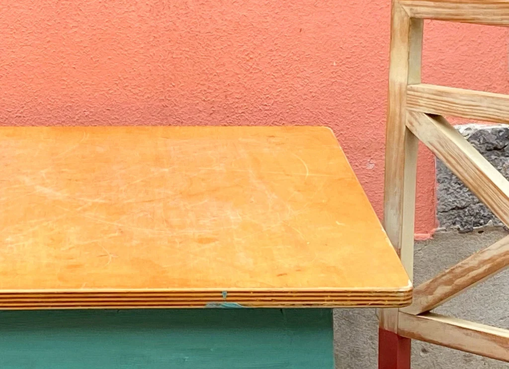 orange wall, yellowish table and green 