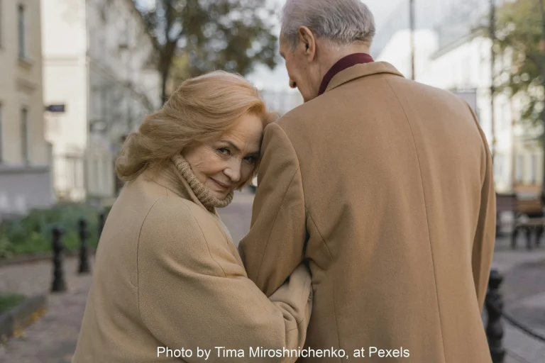 photo of couple walking away from camera, woman is looking back at camera, sex and menopause