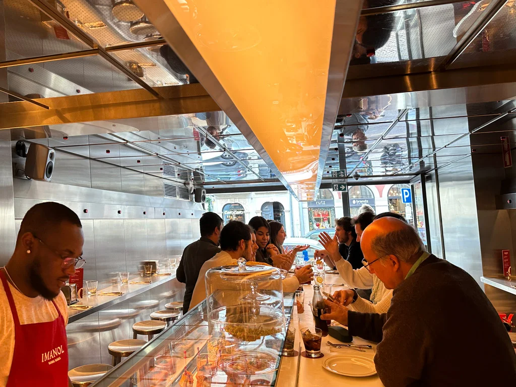 lunch at Imanol people around the counter at Spanish tapas at Imanol