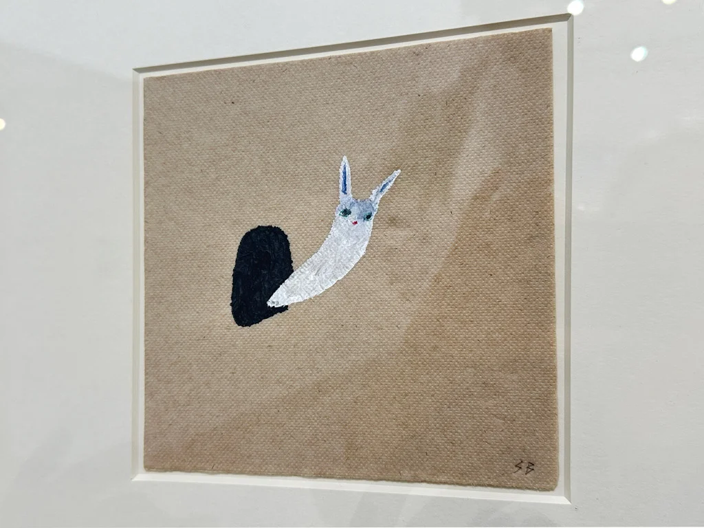 small painting of a snail on brown paper, Sara Bichao painting Beato