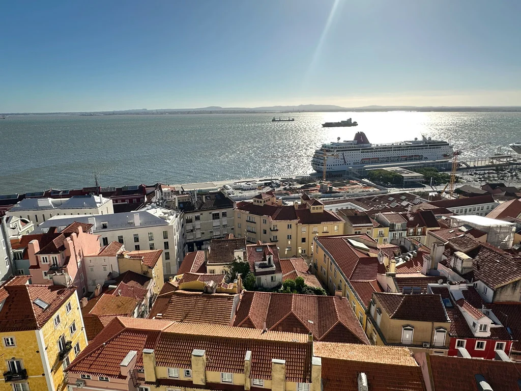 View of River Tejo Lisbon in the wnter from above, there is a tourist boat on the water