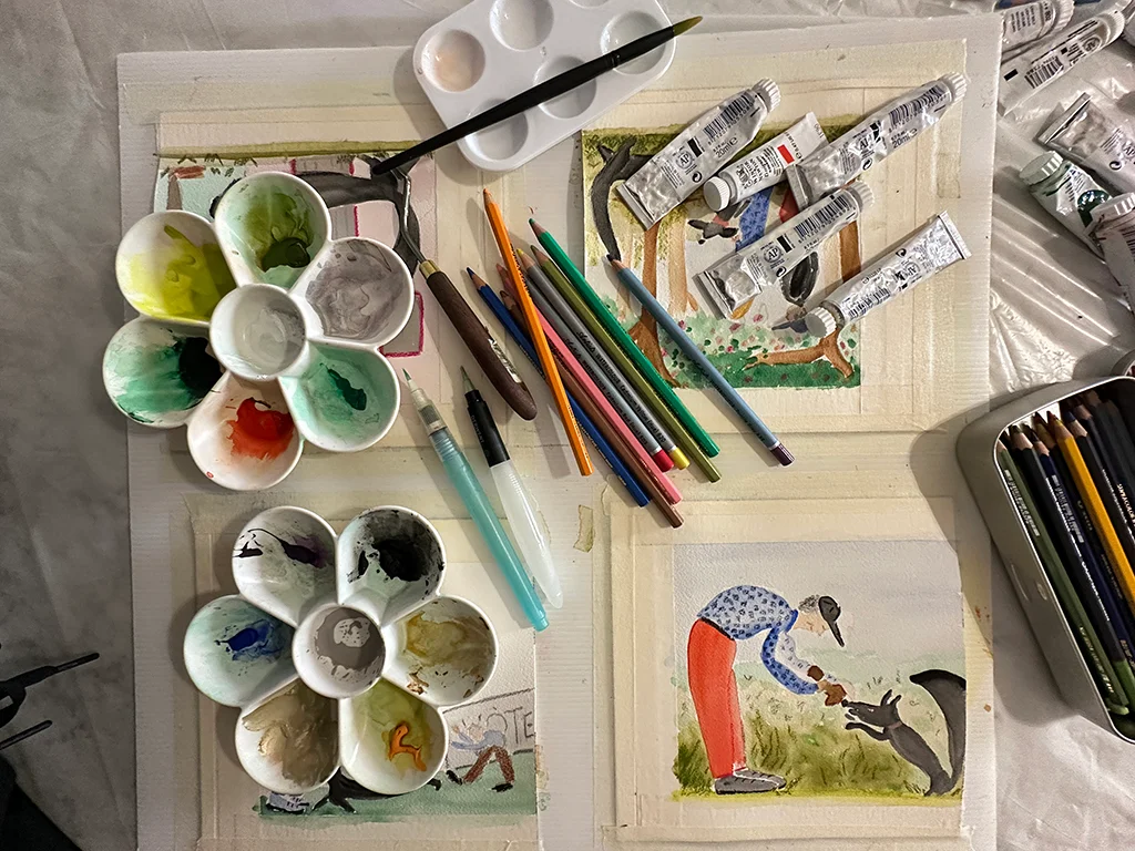 set of water colour paints, brushes, a drawing, hobbies for the winter, cozy ideas